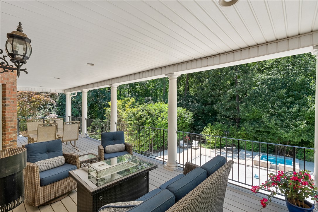 200 Graylyn Drive Anderson, SC 29621 - Photo 38 of 48 An inviting covered deck overlooks verdant woodlands, ideal for peaceful gatherings and al fresco relaxation.