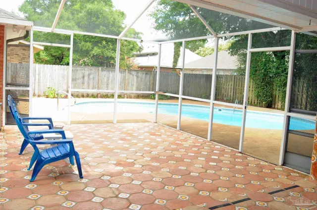 a swimming pool with chairs