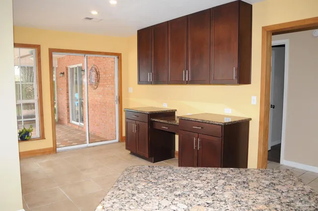 a view of a kitchen with wooden floor and cabinet
