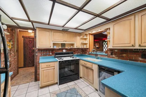 a outdoor living space with furniture and a fireplace