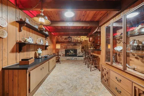 a dining room with furniture and a chandelier