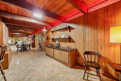 a bed sitting in a room next to a window