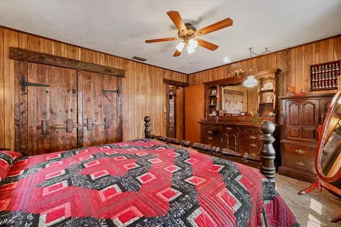 a bedroom with furniture and a window