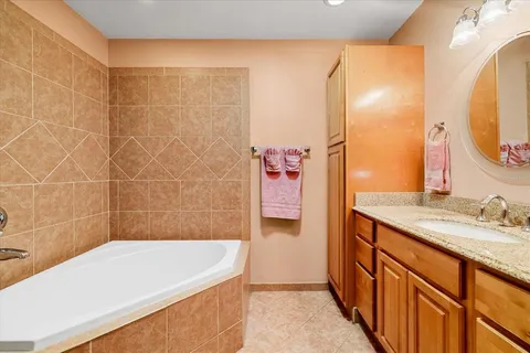 a bathroom with a bathtub and a sink