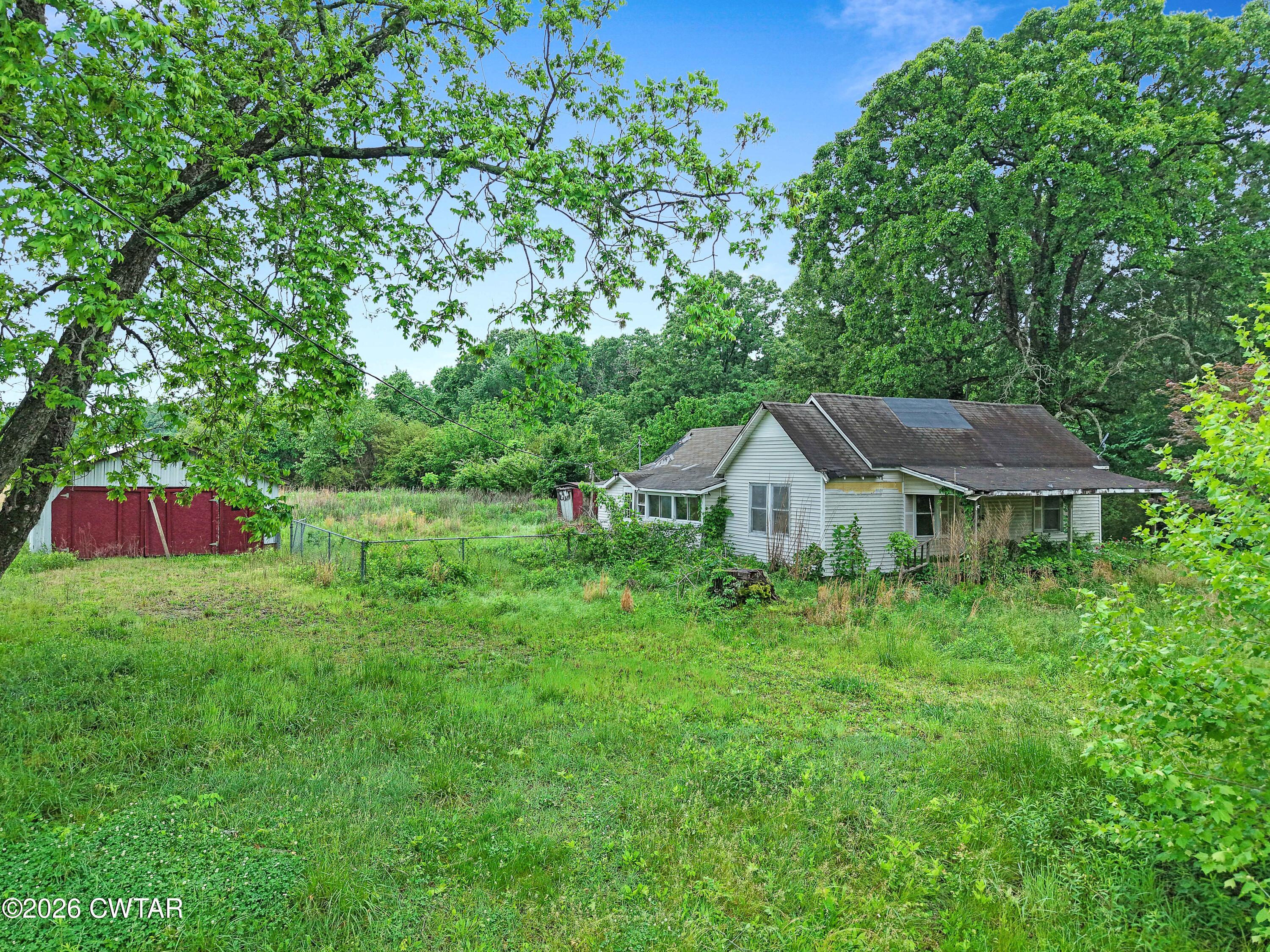 1525 Mill Creek Road Cedar Grove, TN 38321 - Photo 11 of 15 a backyard of a house with seating space