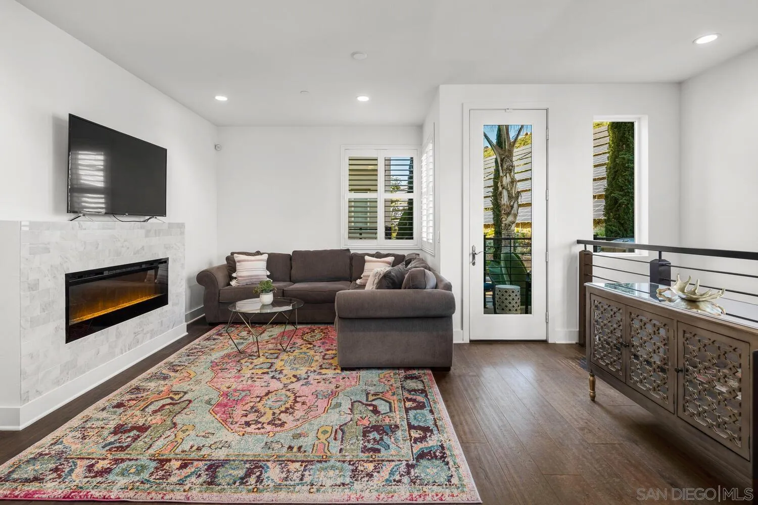 7845 Modern Oasis Drive San Diego, CA 92108 - Photo 11 of 39 a living room with furniture and a fireplace