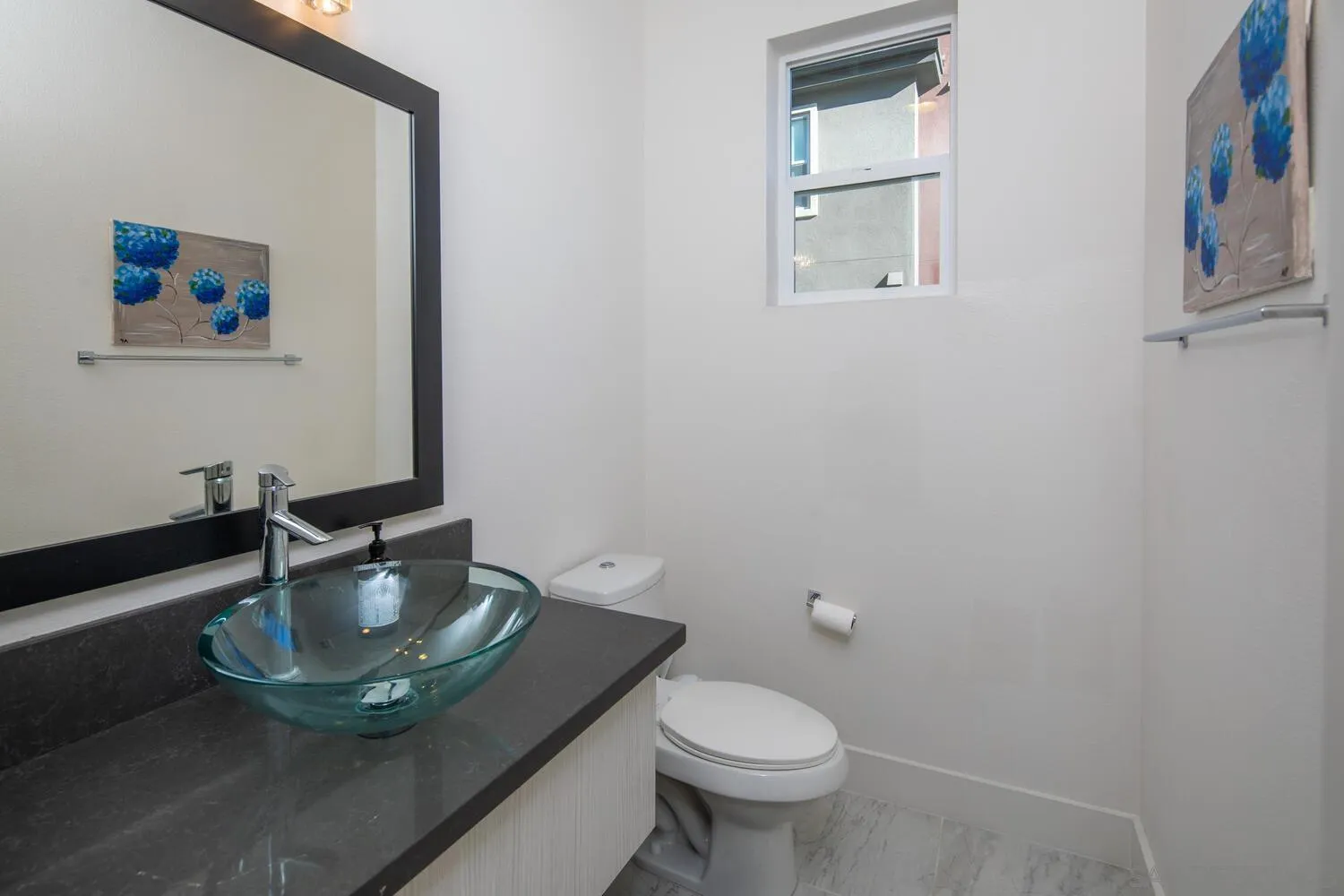 7845 Modern Oasis Drive San Diego, CA 92108 - Photo 18 of 39 a bathroom with a sink and a mirror
