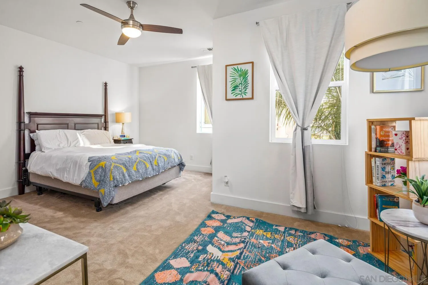 7845 Modern Oasis Drive San Diego, CA 92108 - Photo 20 of 39 a bedroom with a bed table and window