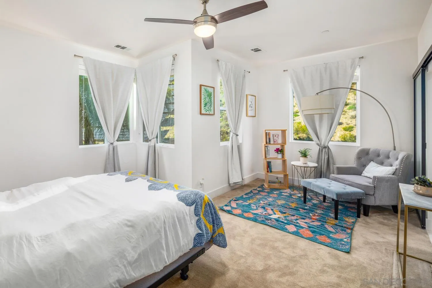 7845 Modern Oasis Drive San Diego, CA 92108 - Photo 22 of 39 a bedroom with a bed window and table