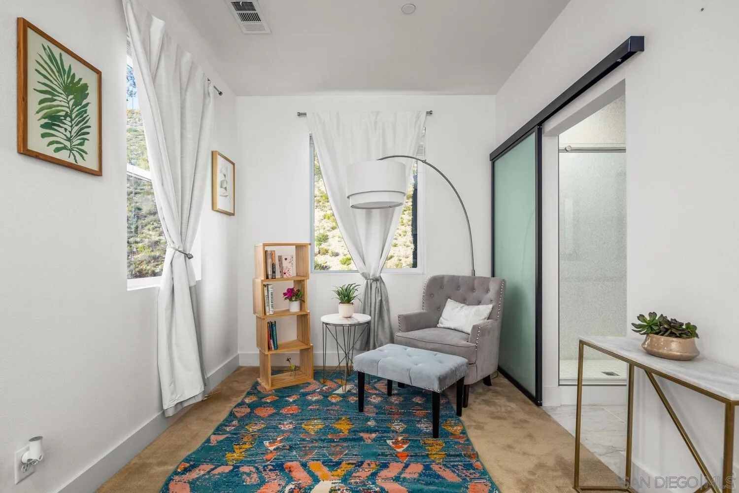 7845 Modern Oasis Drive San Diego, CA 92108 - Photo 23 of 39 a living room with furniture and a table