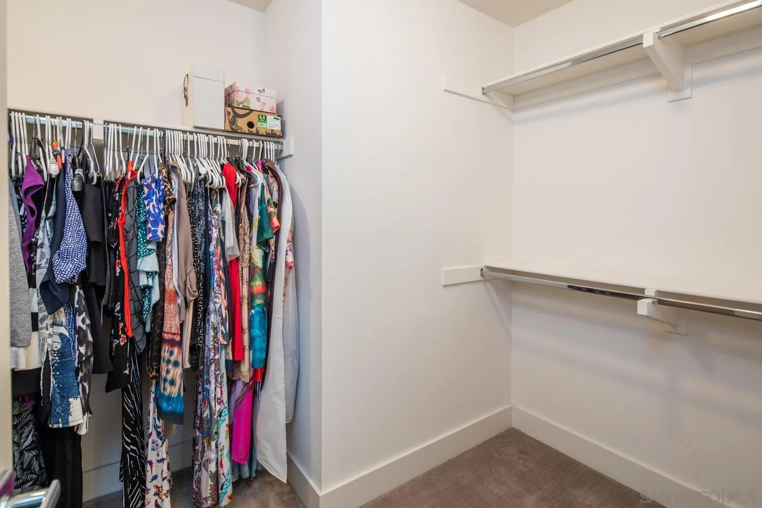 7845 Modern Oasis Drive San Diego, CA 92108 - Photo 25 of 39 a view of walk in closet with clothes