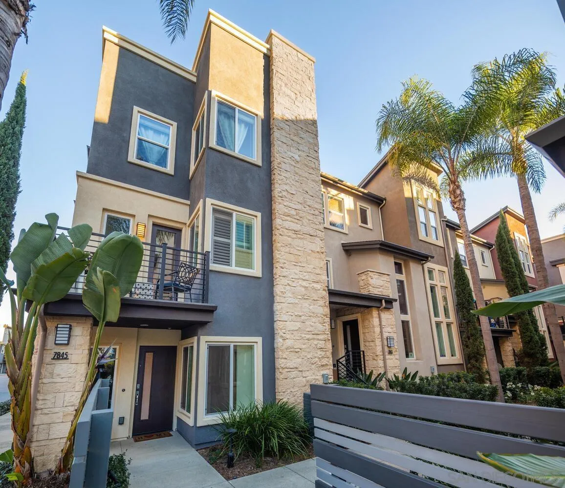 7845 Modern Oasis Drive San Diego, CA 92108 - Photo 3 of 39 a view of a brick building with many windows