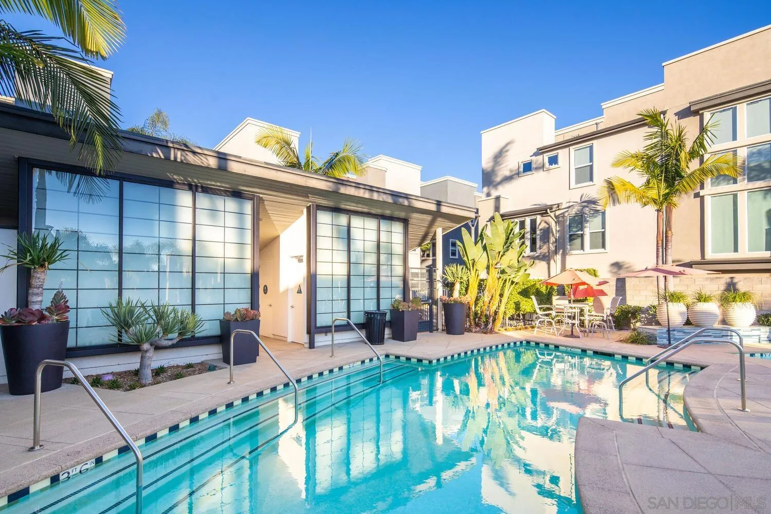 7845 Modern Oasis Drive San Diego, CA 92108 - Photo 33 of 39 a view of a swimming pool with outdoor seating