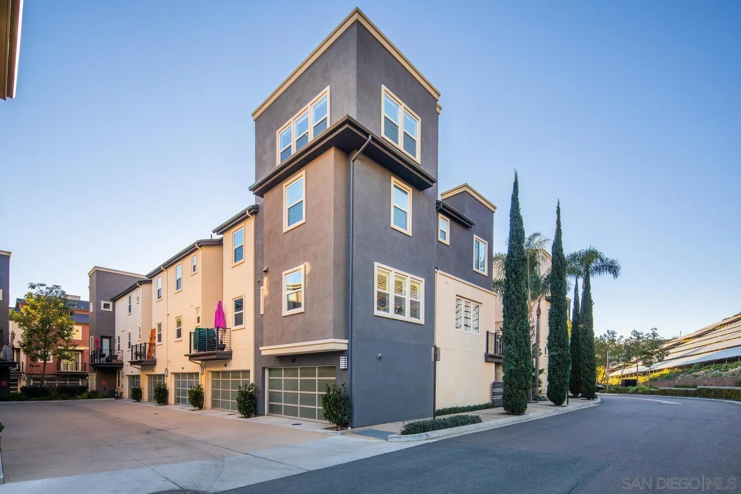 7845 Modern Oasis Drive San Diego, CA 92108 - Photo 5 of 39 a view of a street with buildings
