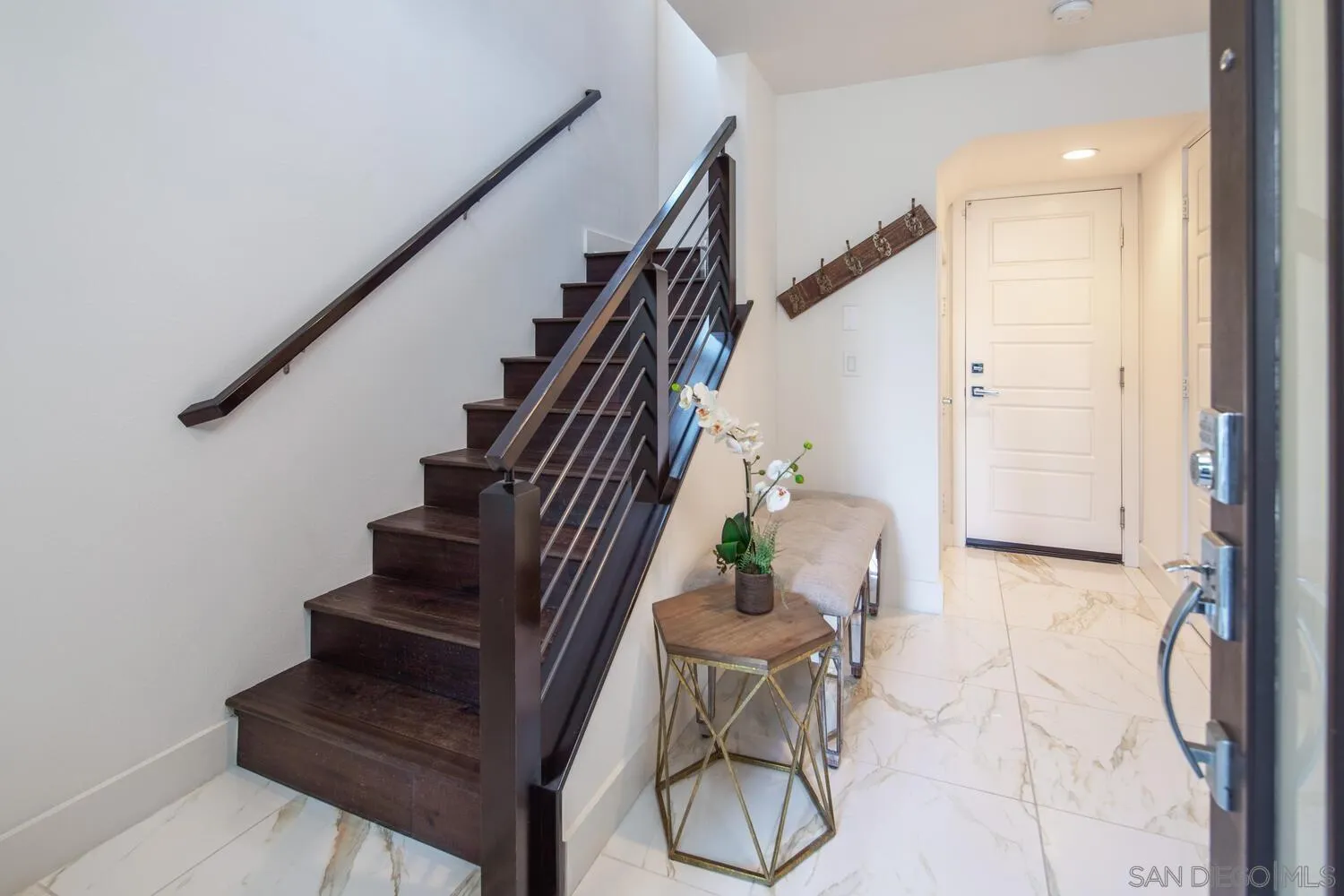 7845 Modern Oasis Drive San Diego, CA 92108 - Photo 6 of 39 a view of entryway and hall with wooden floor