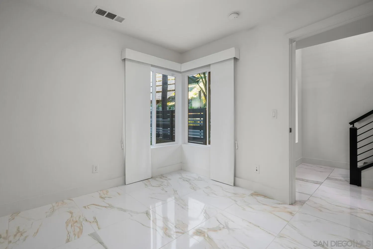 7845 Modern Oasis Drive San Diego, CA 92108 - Photo 7 of 39 a view of an empty room with a window