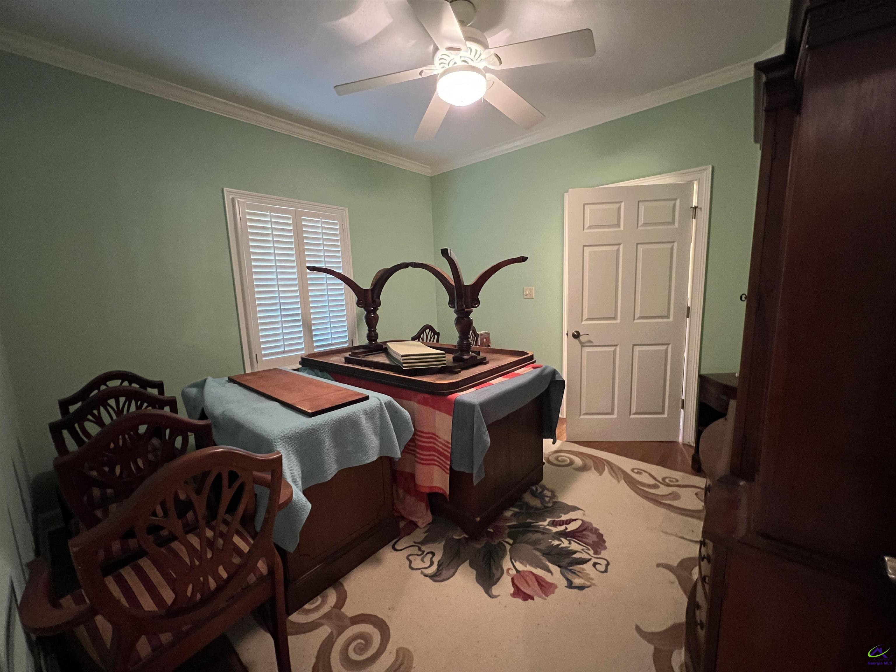 762 Nicholson-Carr Road Chester, GA 31012 - Photo 15 of 81 a bedroom with a bed and a chandelier