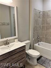 1599 Marton Court Naples, FL 34113 - Photo 14 of 22 a bathroom with a sink a toilet and shower