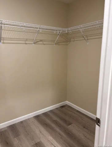 a view of an empty walk in closet