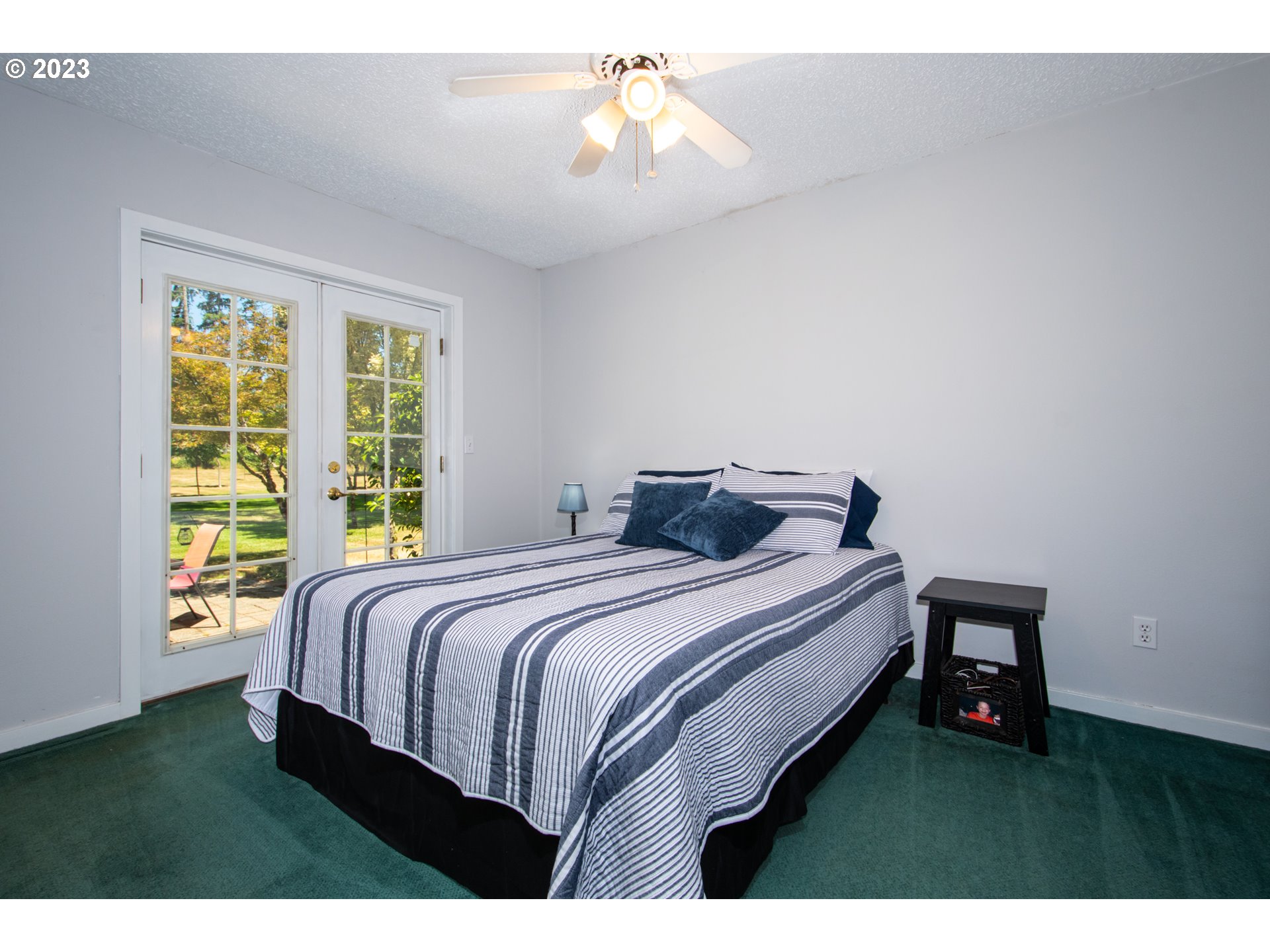 30400 Northeast Healy Road Amboy, WA 98601 - Photo 15 of 48 a bedroom with a bed and a chandelier