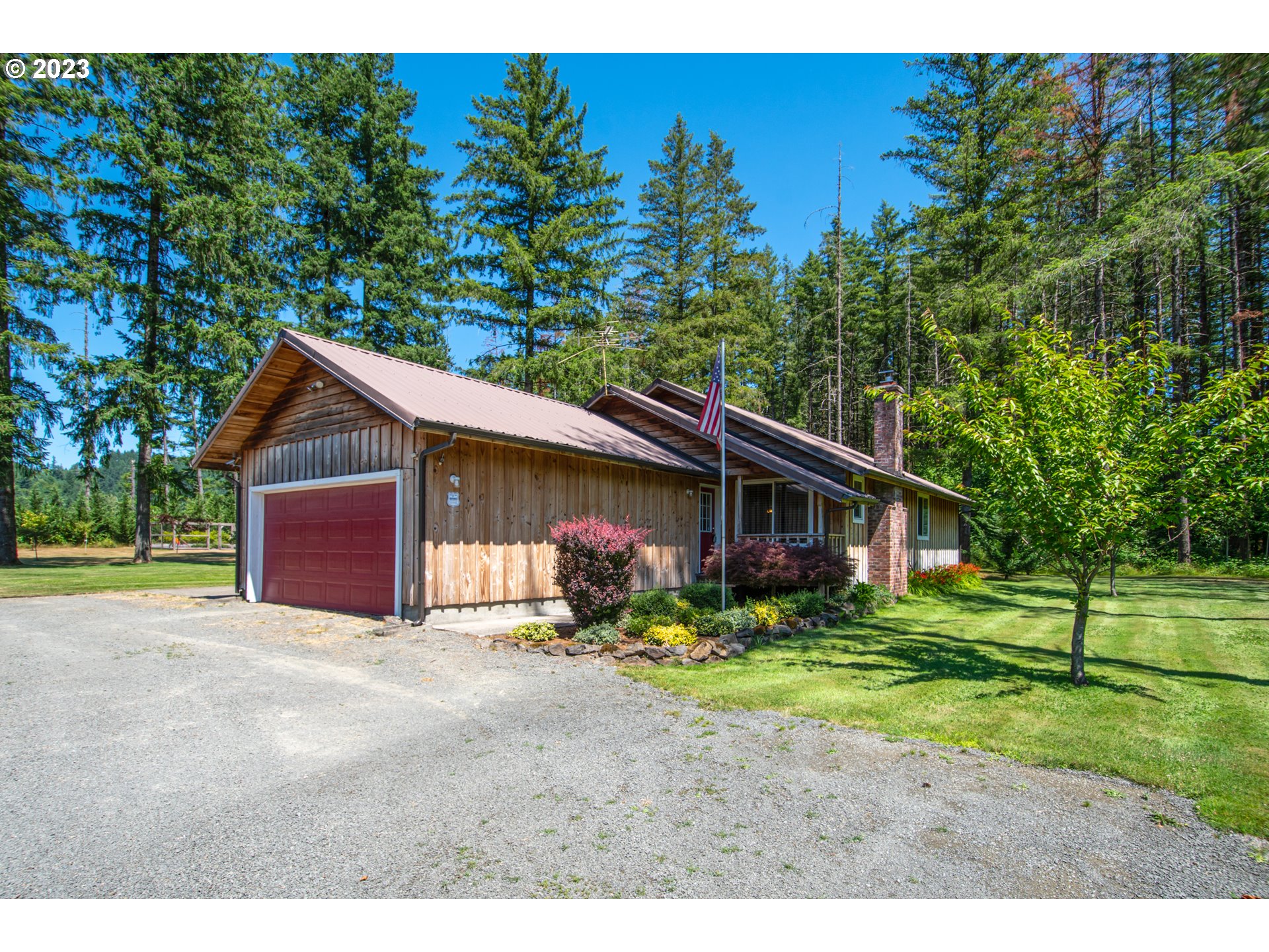 30400 Northeast Healy Road Amboy, WA 98601 - Photo 3 of 48 a view of a house with a yard and large trees