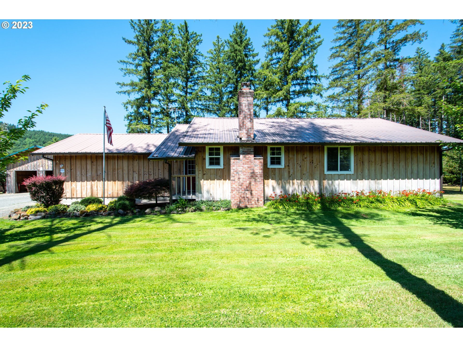 30400 Northeast Healy Road Amboy, WA 98601 - Photo 34 of 48 a front view of a house with a garden and trees