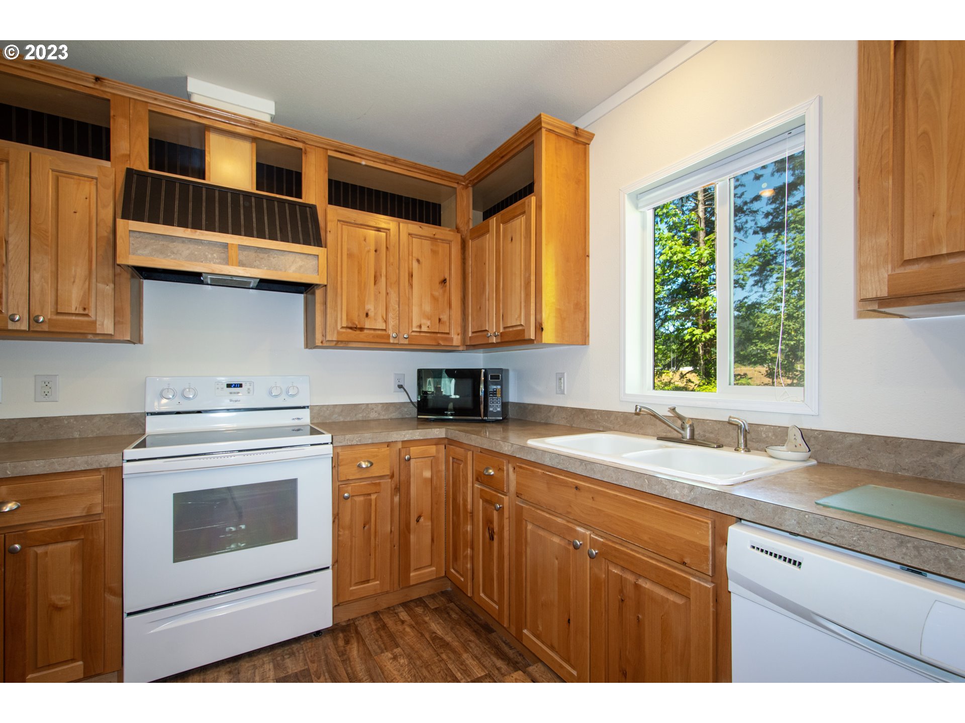 30400 Northeast Healy Road Amboy, WA 98601 - Photo 43 of 48 a kitchen with stainless steel appliances granite countertop a sink a stove and a microwave