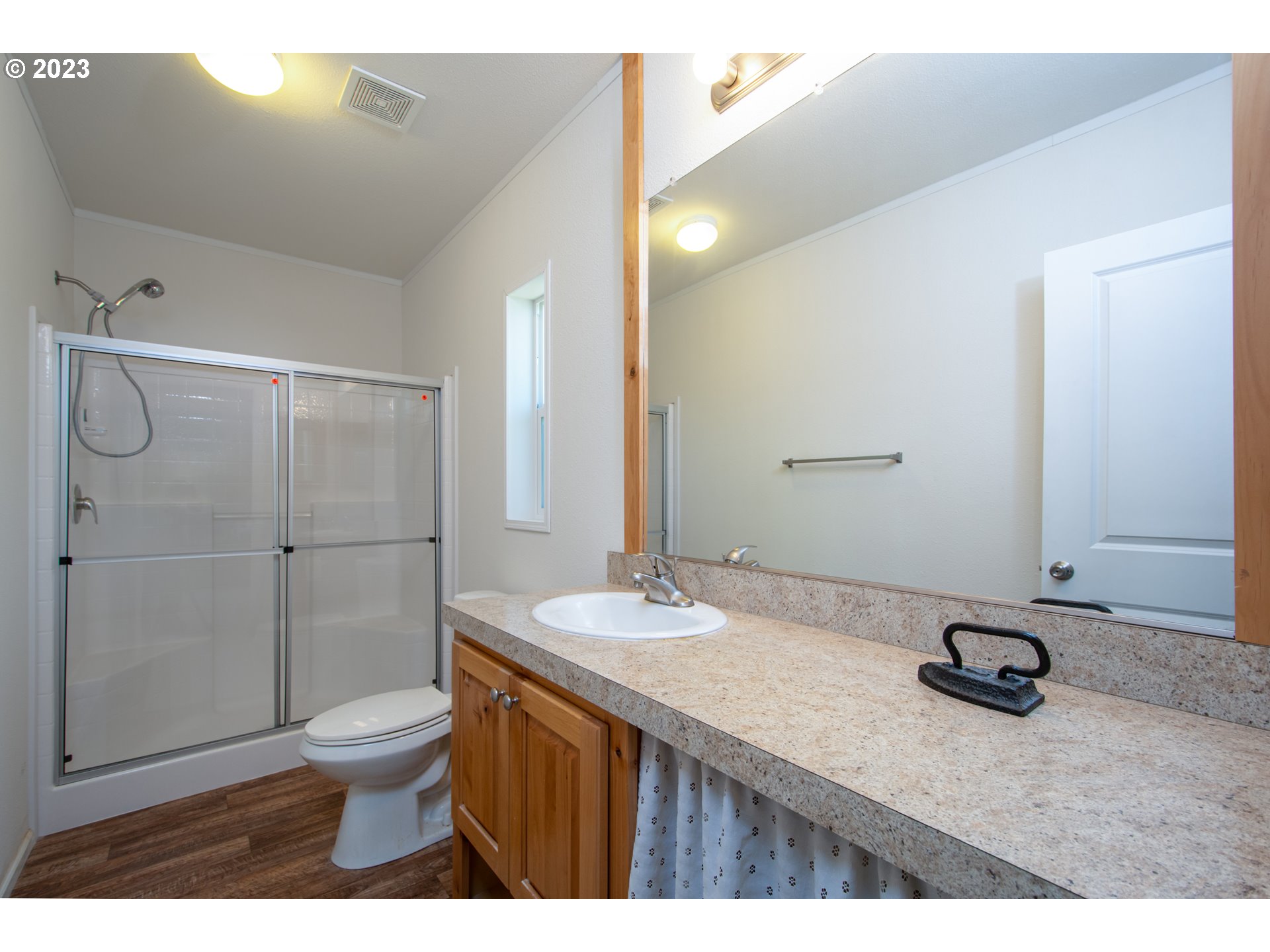 30400 Northeast Healy Road Amboy, WA 98601 - Photo 45 of 48 a bathroom with a granite countertop sink toilet a mirror and shower