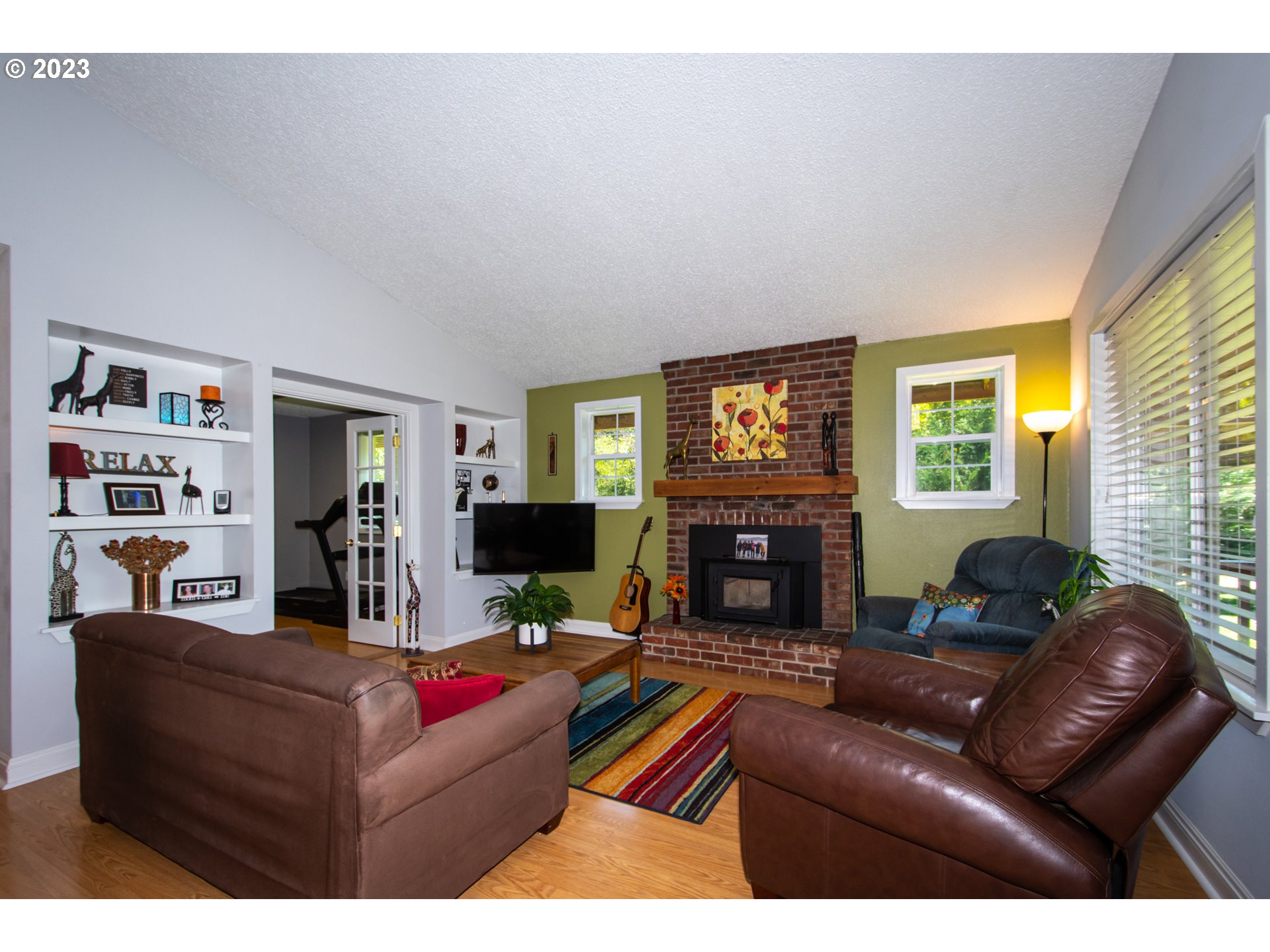 30400 Northeast Healy Road Amboy, WA 98601 - Photo 6 of 48 a living room with furniture flat screen tv and a fireplace
