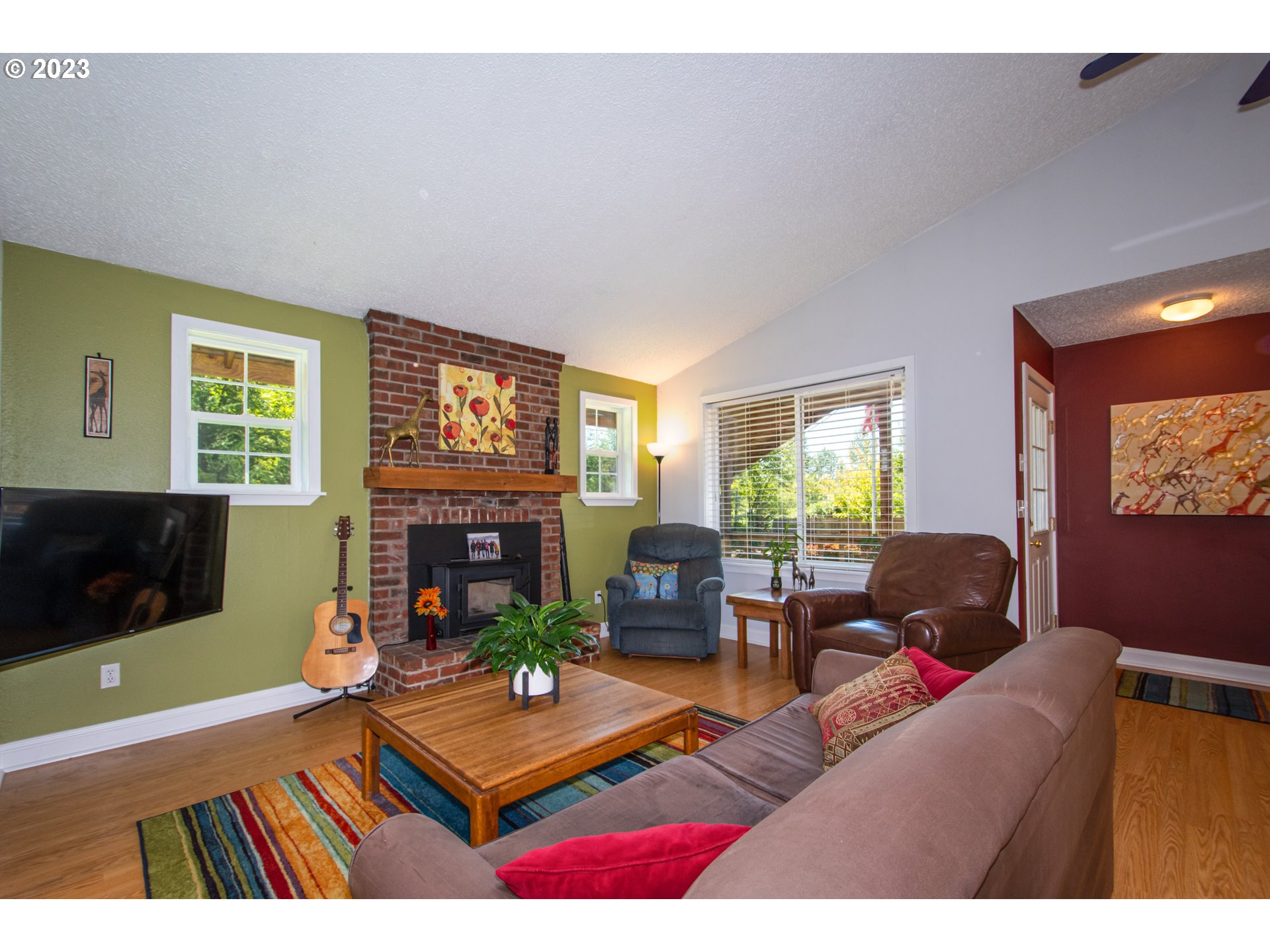 30400 Northeast Healy Road Amboy, WA 98601 - Photo 8 of 48 a living room with furniture a flat screen tv and a fireplace