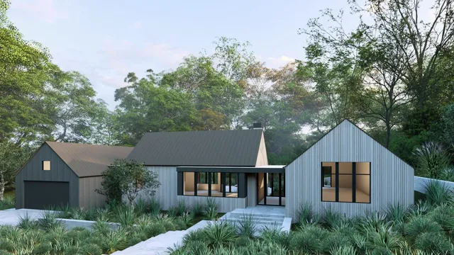 a front view of a house with a yard and trees