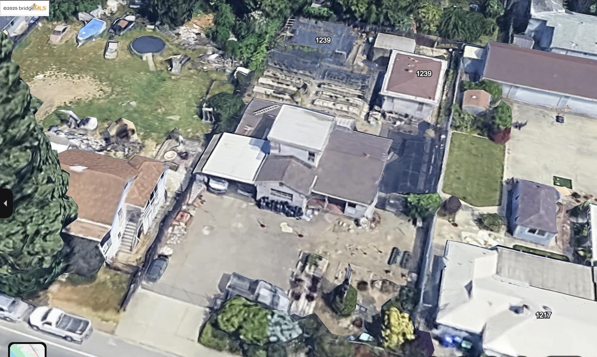 an aerial view of a house with a yard and lake view