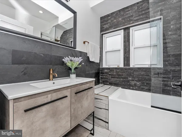 a bathroom with a sink and a bathtub