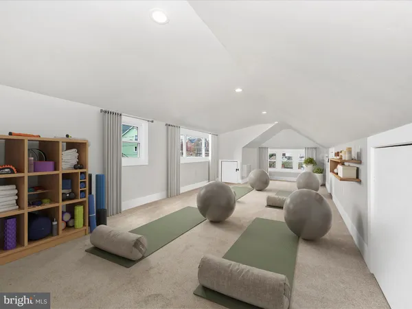 a bedroom with furniture and a book shelf