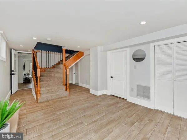 a view of entryway with wooden floor