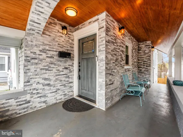 a view of front door of house with stairs