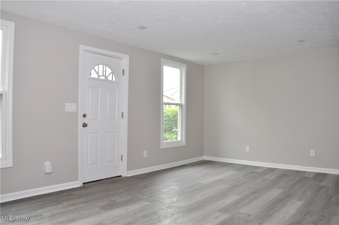 7604 Spafford Road Cleveland, OH 44105 - Photo 11 of 23 Entrance foyer with wood finished floors and baseboards