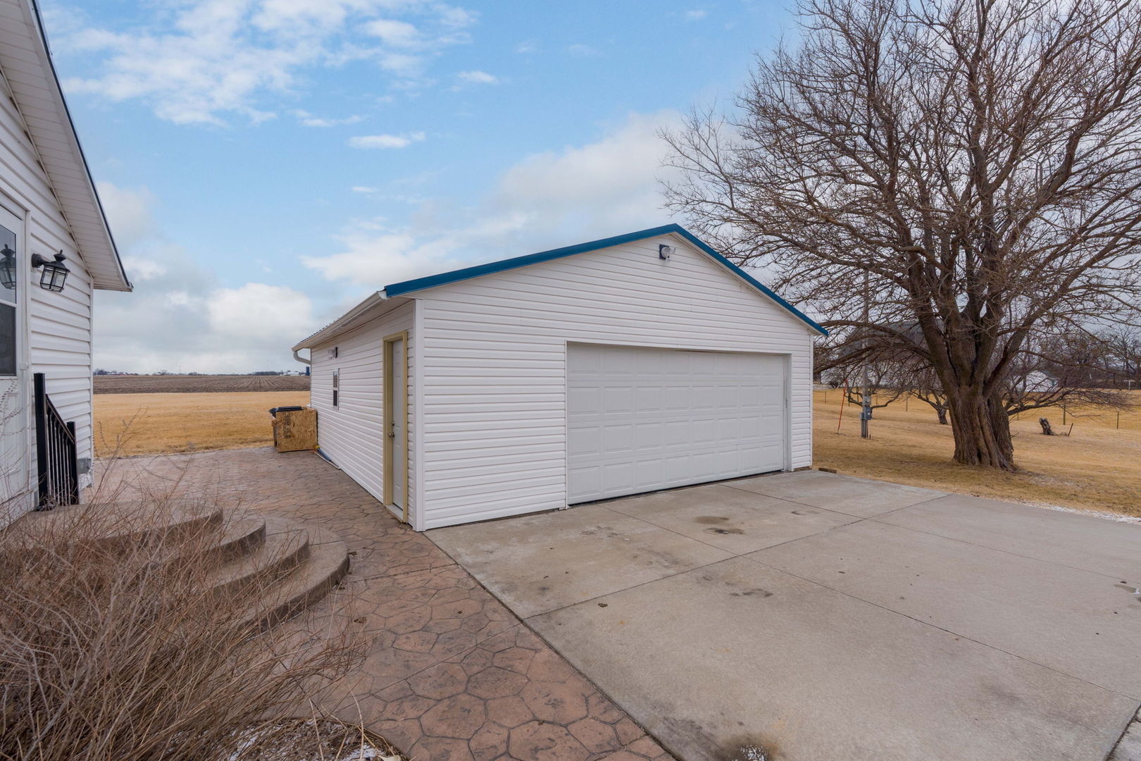 12596 East 200th Street Orion, IL 61273 - Photo 19 of 27 a view of a house with a yard and garage