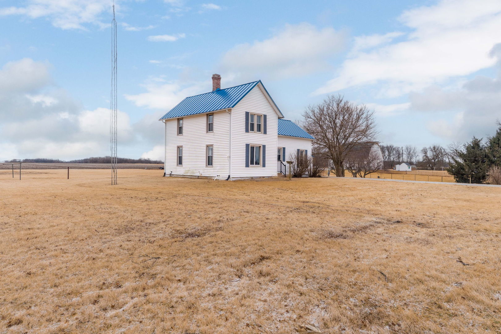 12596 East 200th Street Orion, IL 61273 - Photo 22 of 27 a view of a house with a yard covered with snow