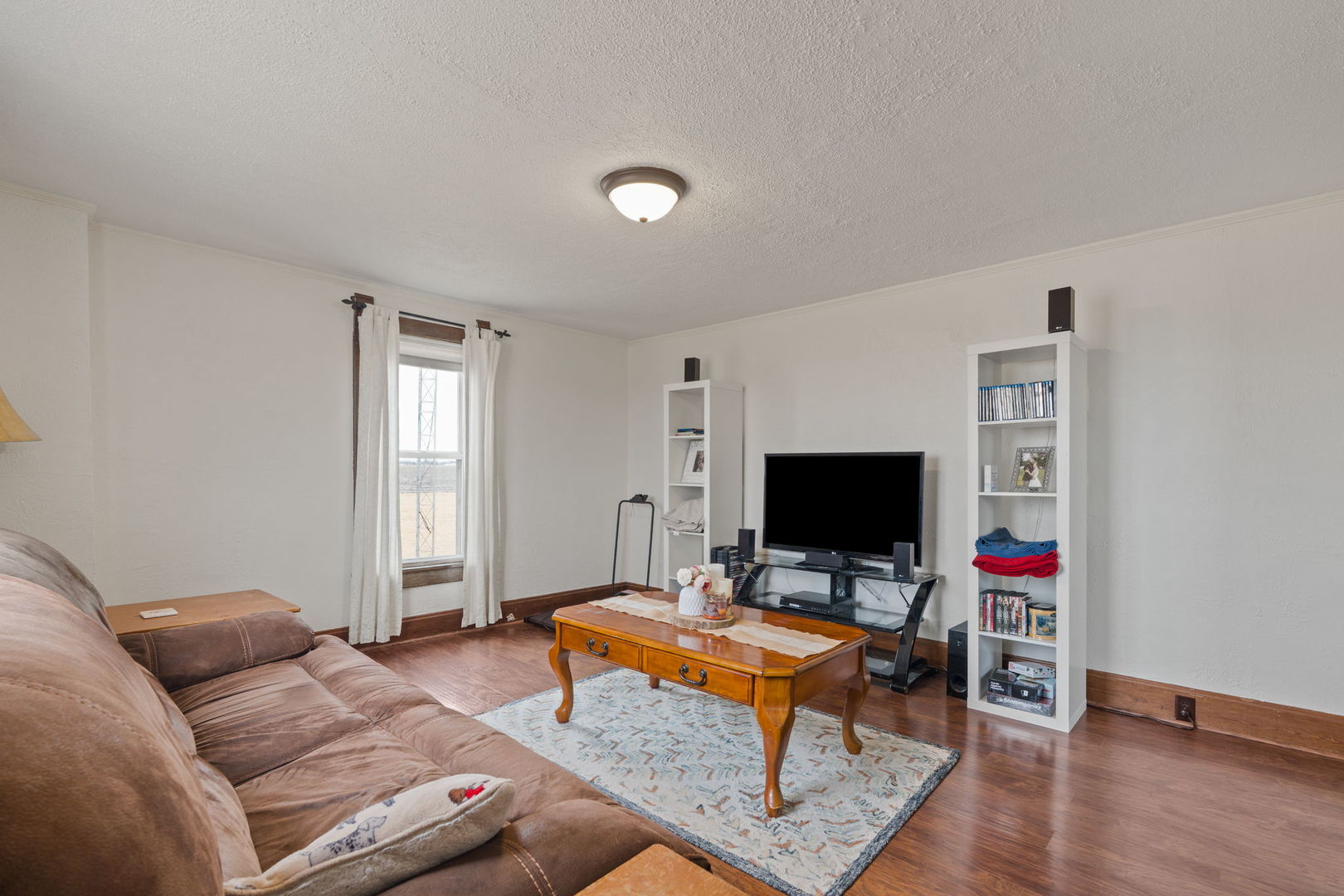 12596 East 200th Street Orion, IL 61273 - Photo 6 of 27 a living room with furniture and a flat screen tv