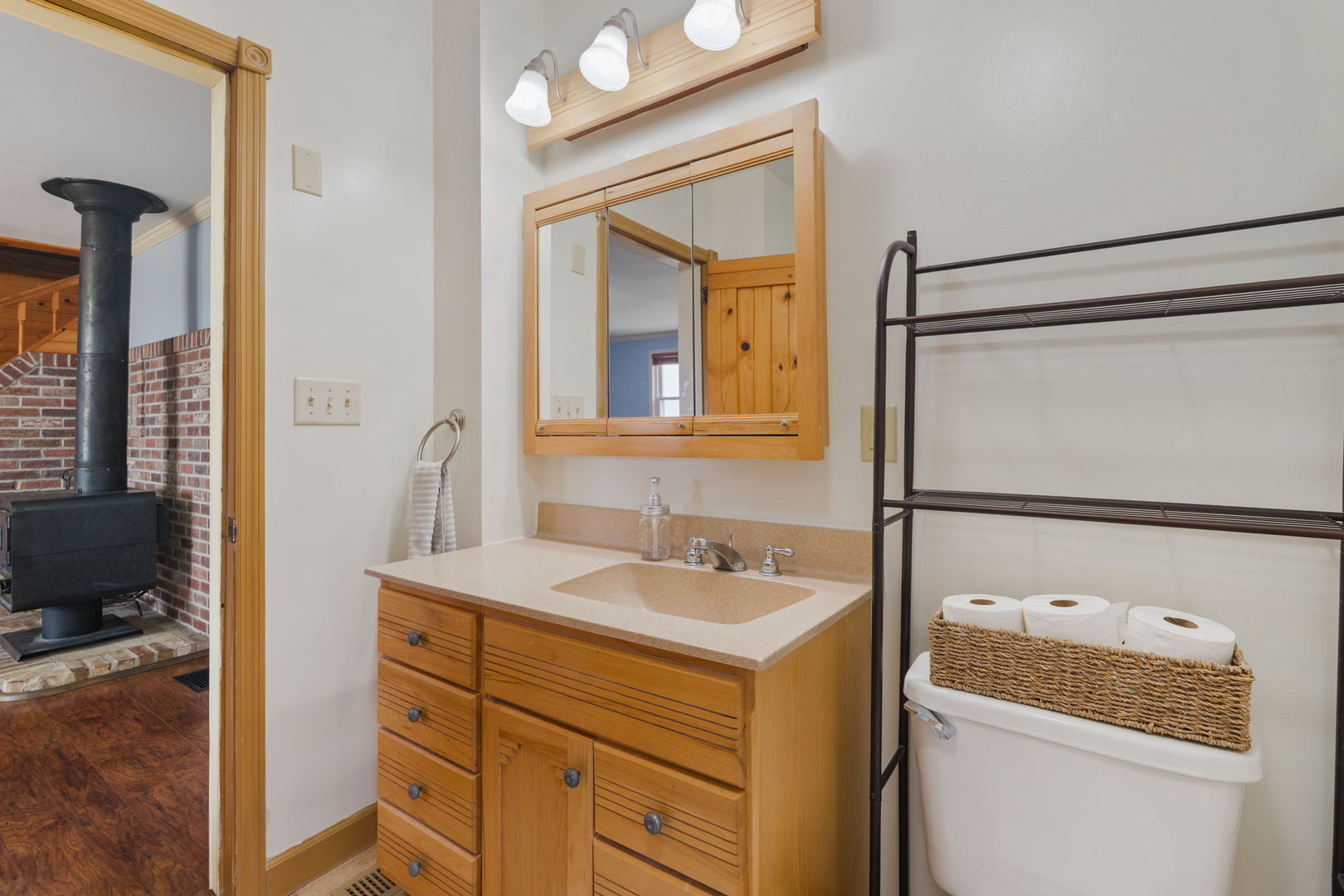 12596 East 200th Street Orion, IL 61273 - Photo 7 of 27 a bathroom with a sink a toilet and a mirror
