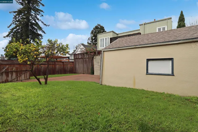 a view of backyard with a garden and entertaining space