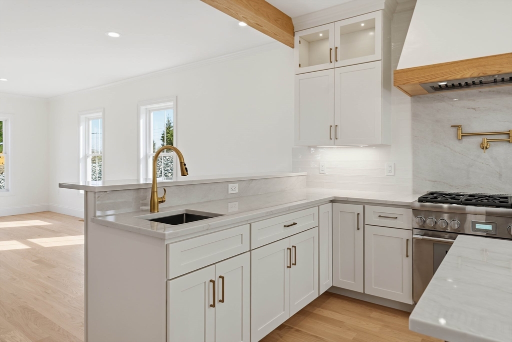 16 Couture Way Middleton, MA 01949 - Photo 8 of 36 a kitchen with white cabinets appliances and sink