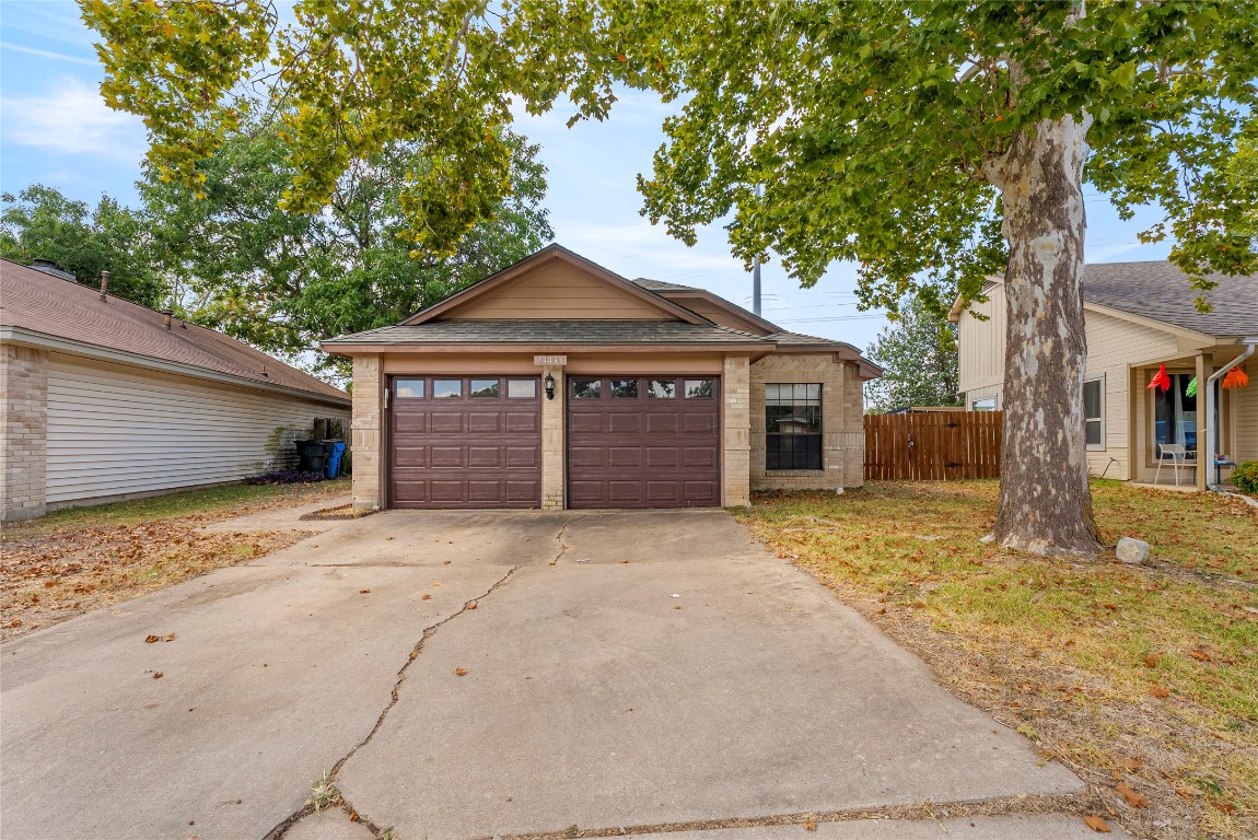 14433 Robert I Walker Boulevard Austin, TX 78728 - Photo 2 of 15 Garage with concrete driveway