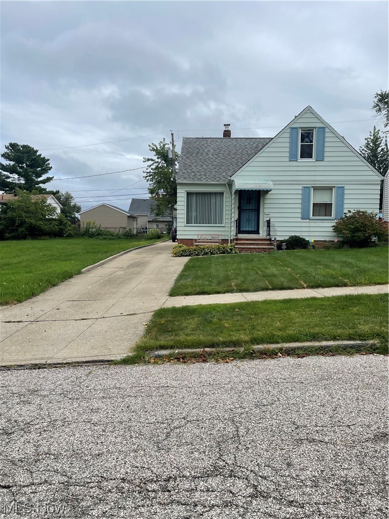 11610 Crofton Road Garfield Heights, OH 44125 - Photo 2 of 19 View of front of house featuring a front yard