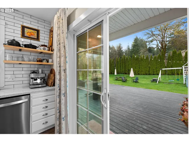 a backyard of a house with barbeque oven