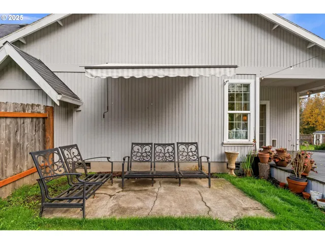 a view of a patio with table and chairs with wooden floor