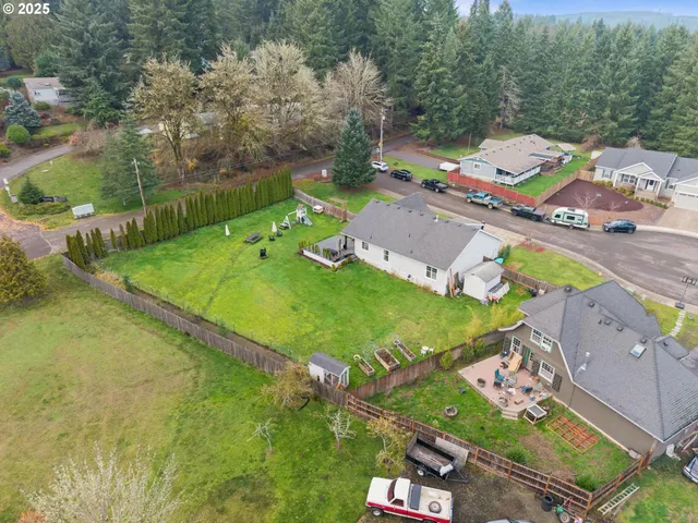 an aerial view of a house with a garden
