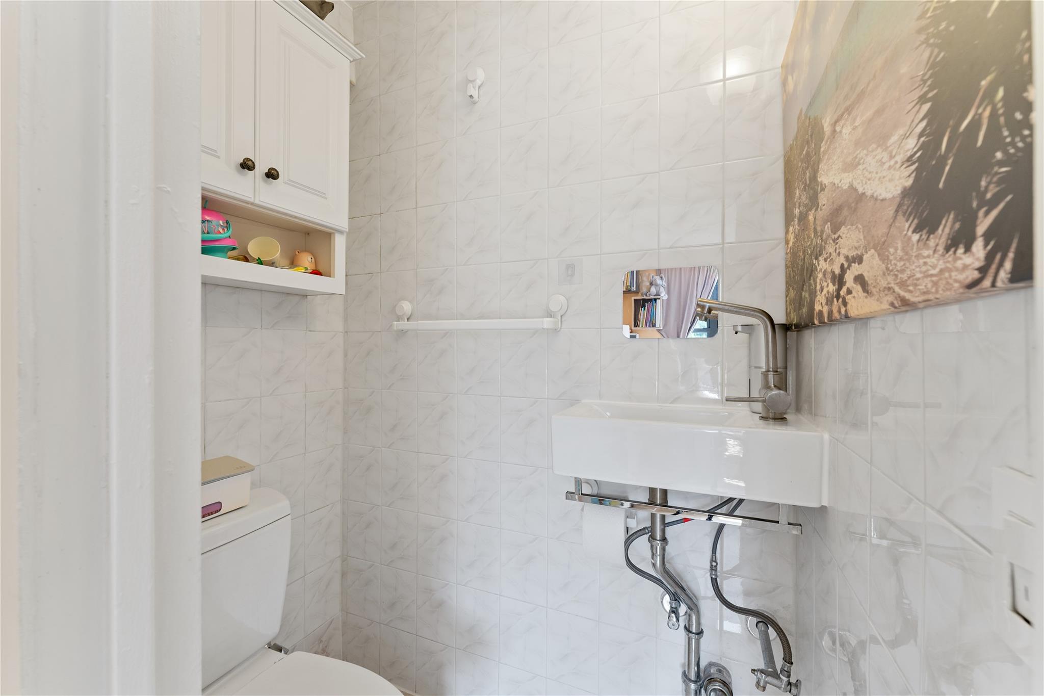 3103 Fairfield Avenue, Unit 5D Bronx, NY 10463 - Photo 11 of 13 a bathroom with a shower and a toilet