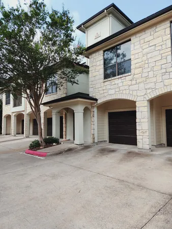 a front view of a house with yard
